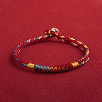 Pulsera Tibetana de Cuerda Roja