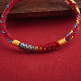 Pulsera Tibetana de Cuerda Roja
